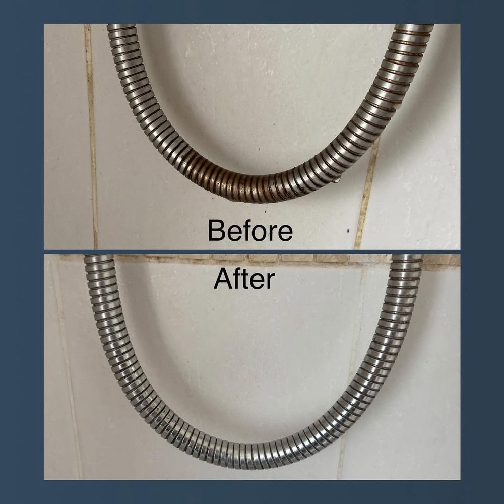 Before and after of a flexible shower hose with limescale and grime removed